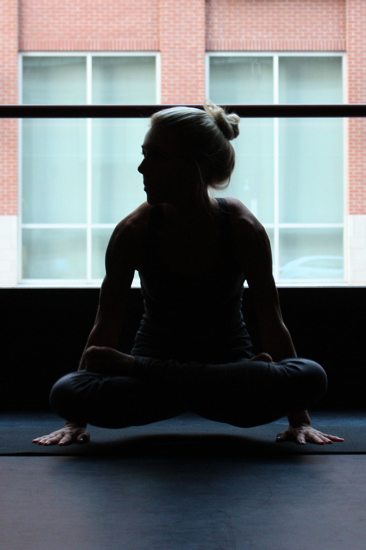 best open cell yoga mat showing a girl doing scale pose tolasana