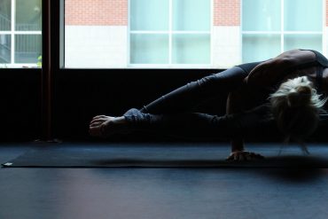 Deba Wilson Practicing Astavakrasana / Eight Angle Yoga Pose