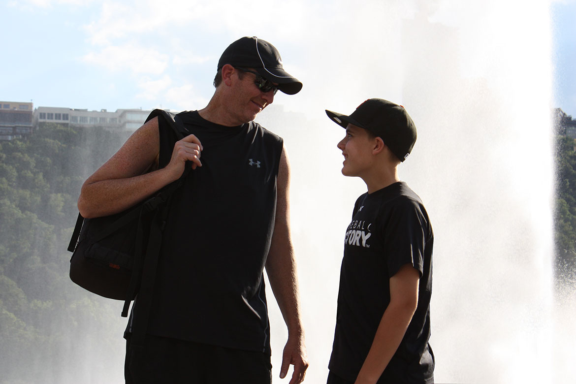 father and son smiling at one another at the Three Rivers Regatta