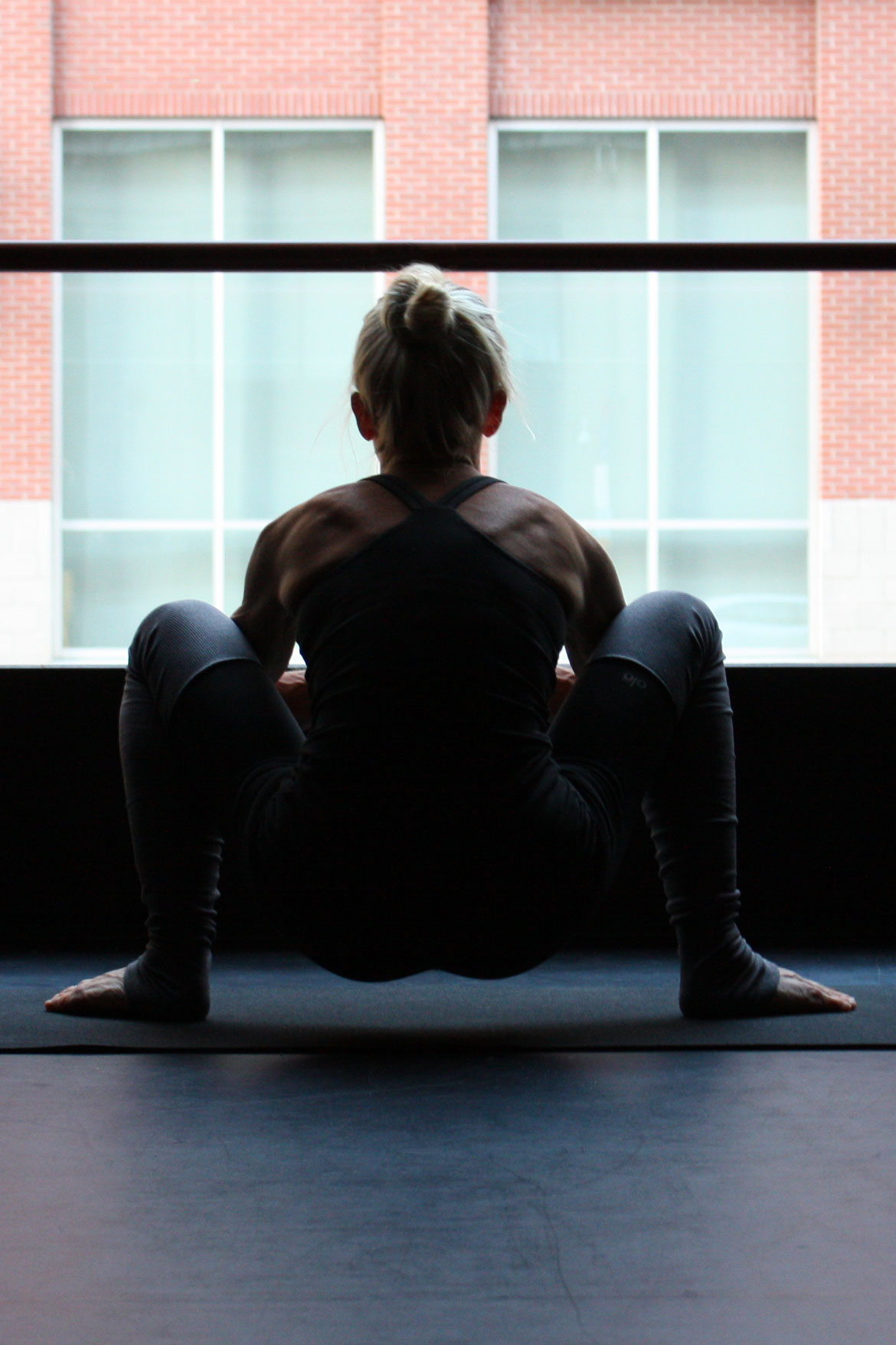 garland pose malasana on natural yoga mat