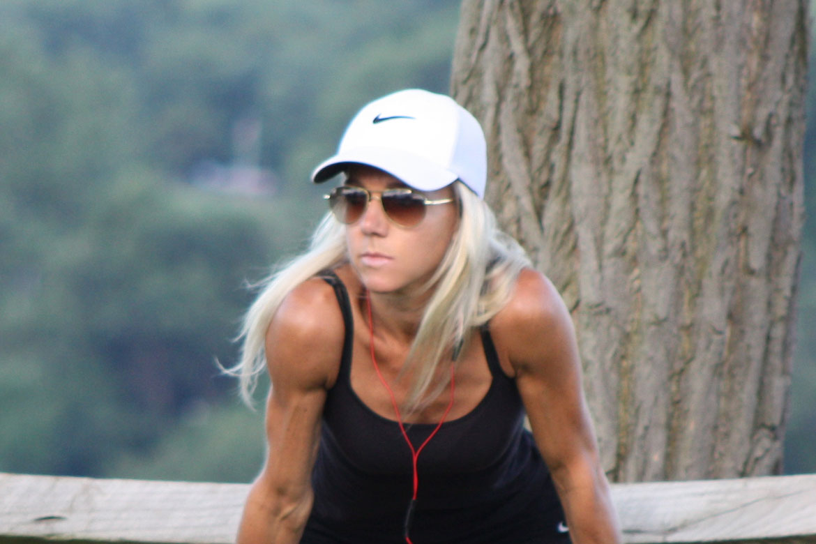 girl stretching during a fitness workout outdoors