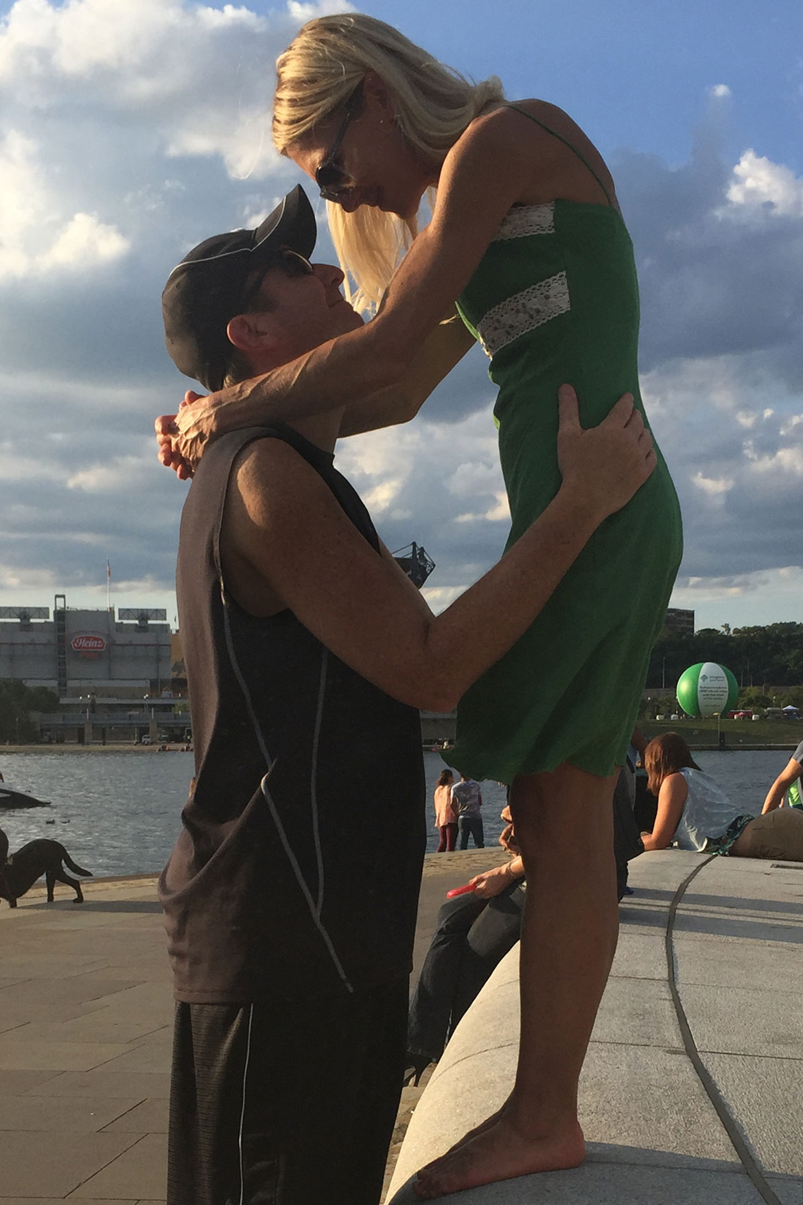 Three Rivers Regatta in Pittsburgh with a husband and wife hugging