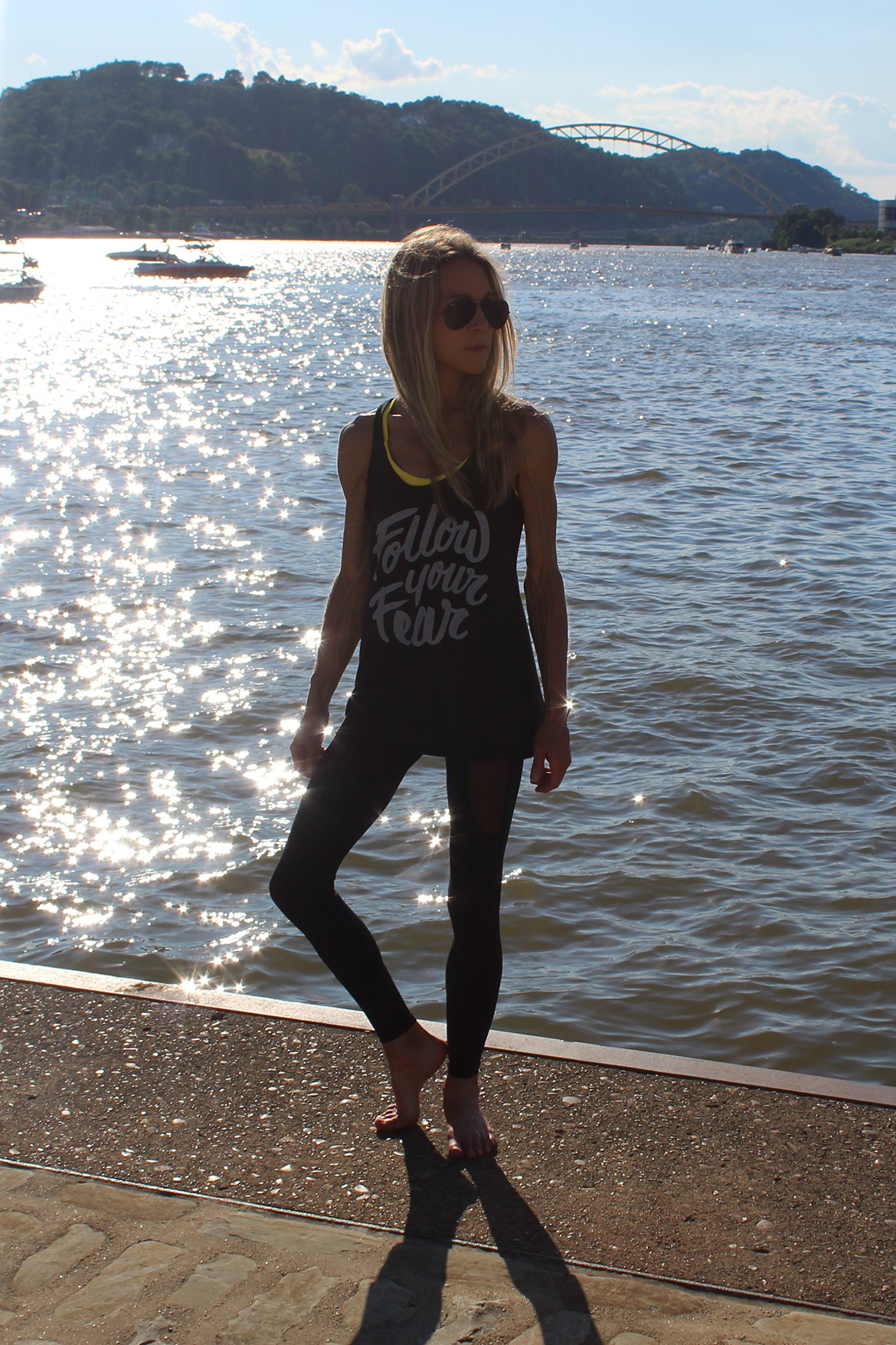 Deba Wilson wearing Follow Your Fear yoga mantra tank